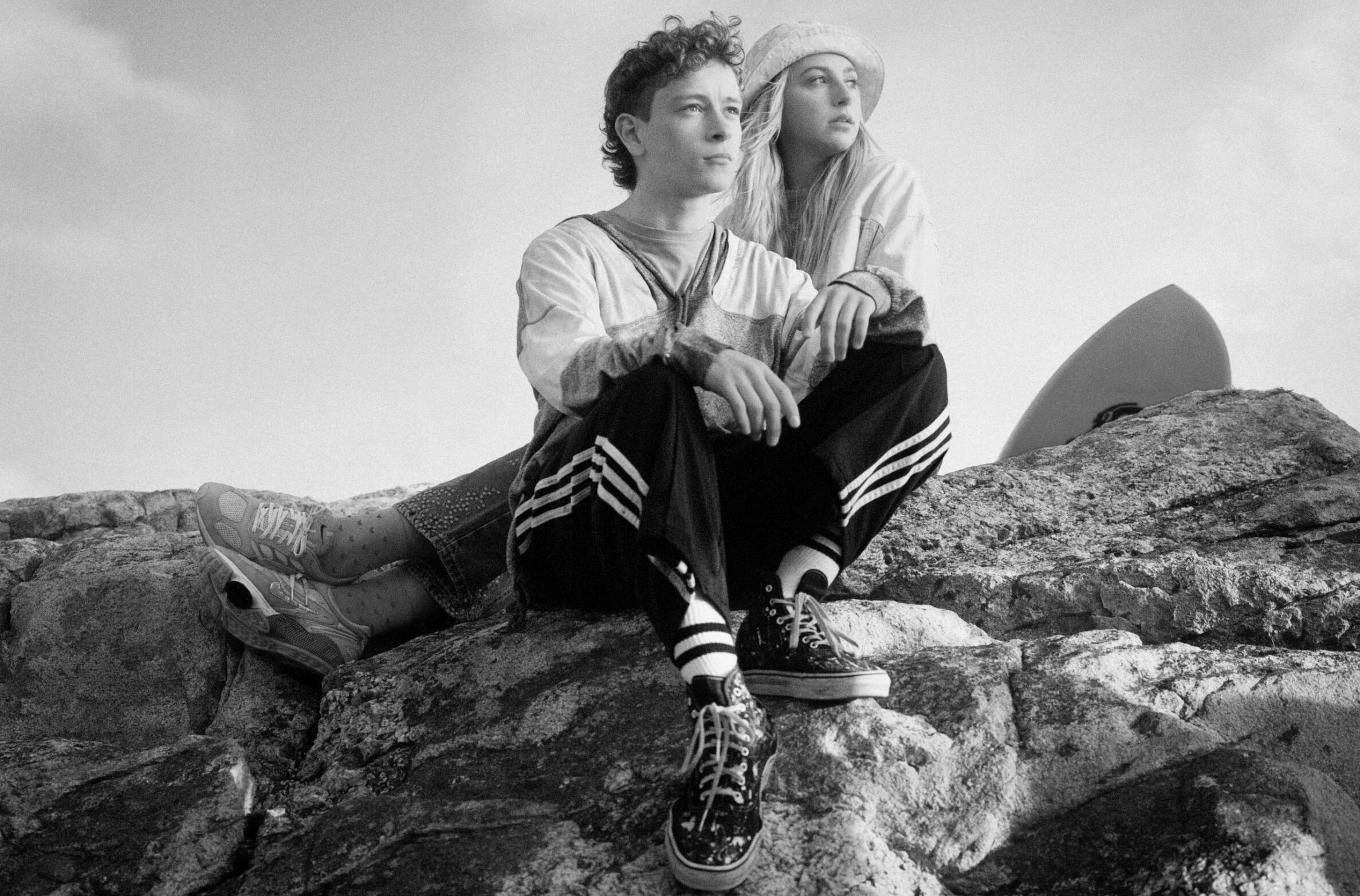 a crowd dancing and singing around a fire